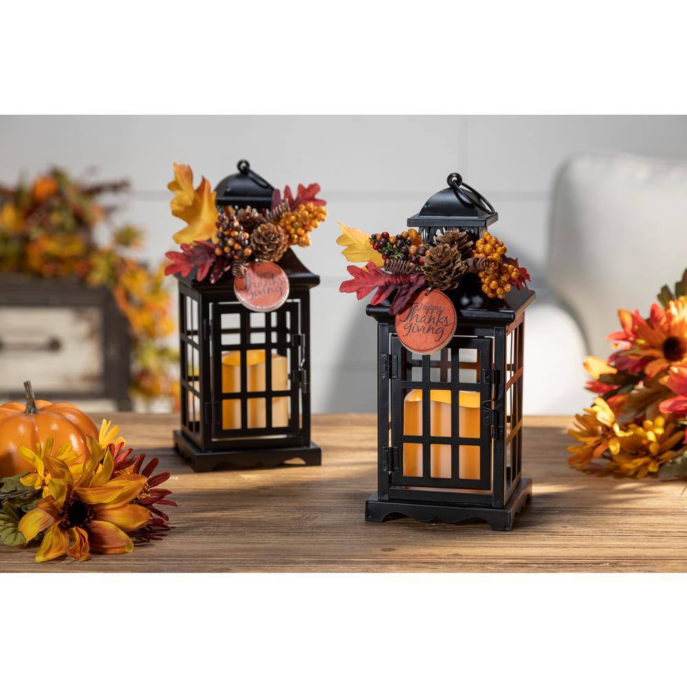 GERSON INTERNATIONAL 10.5 in. H Black Metal Lanterns with B/O LED Candles and Floral Accents (Set of 2)