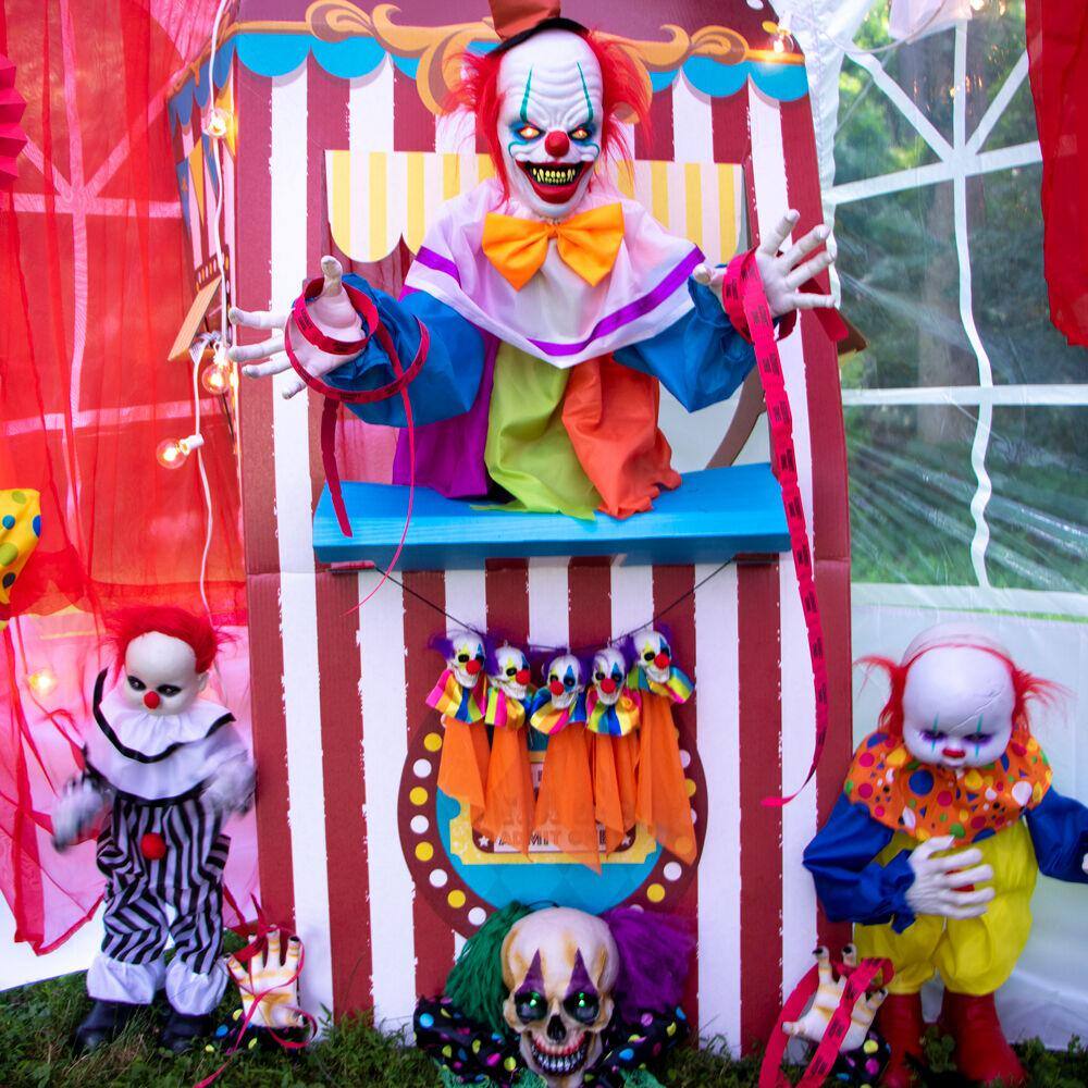 Haunted Hill Farm  25 in. Battery Operated Poseable Animatronic Clown with Red LED Eyes Halloween Prop