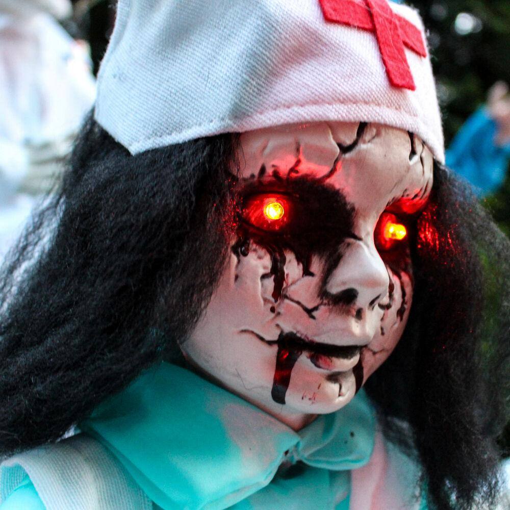 Haunted Hill Farm 21.5 in. Battery Operated Poseable Animatronic Nurse with Red LED Eyes Halloween Prop